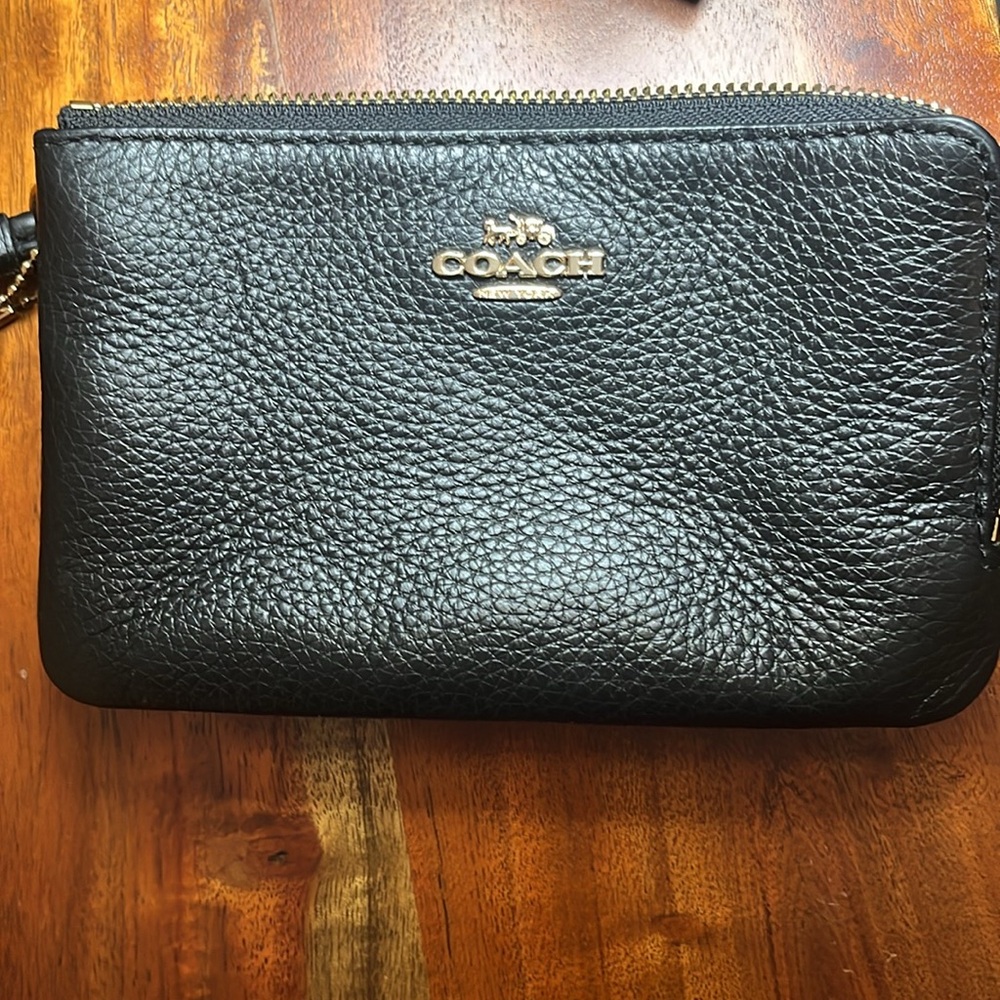 Gently used black double zipper Coach wristlet.
